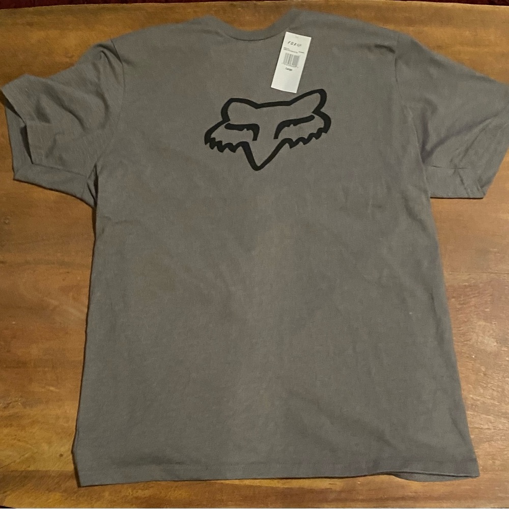 This shirt is new (never worn - wrong size for me) with original tag.